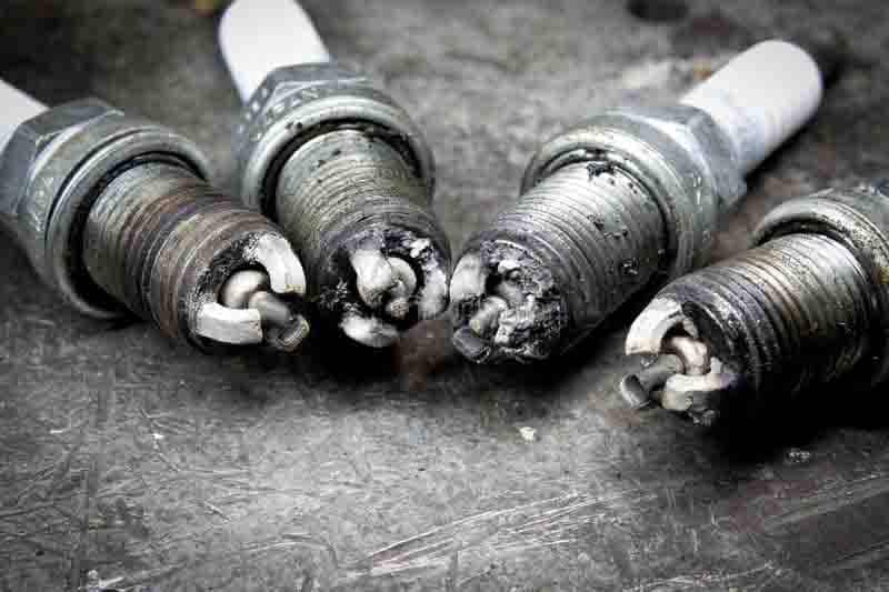 What Does A White Spark Plug Mean