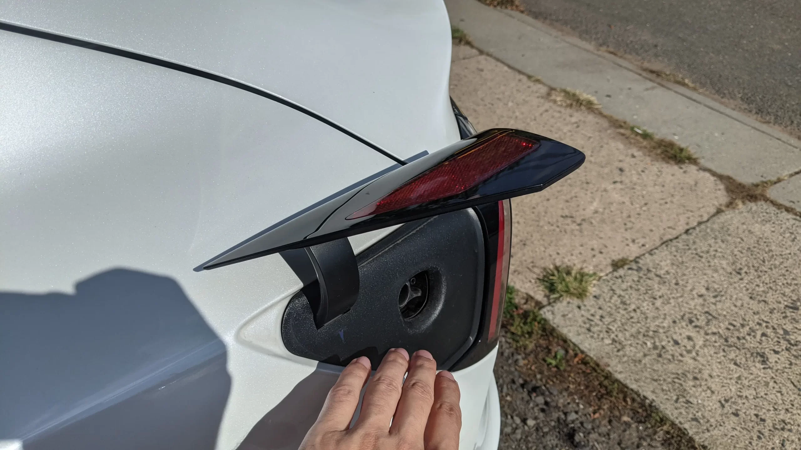 Why Do Tesla Owners Tap the Tail Light: Uncovering the Quirky Habit